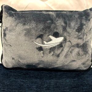 Travel pillow / blanket — use on airplane flights or even in the car.